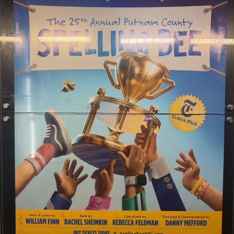 Spelling Bee poster showing trophy and hands